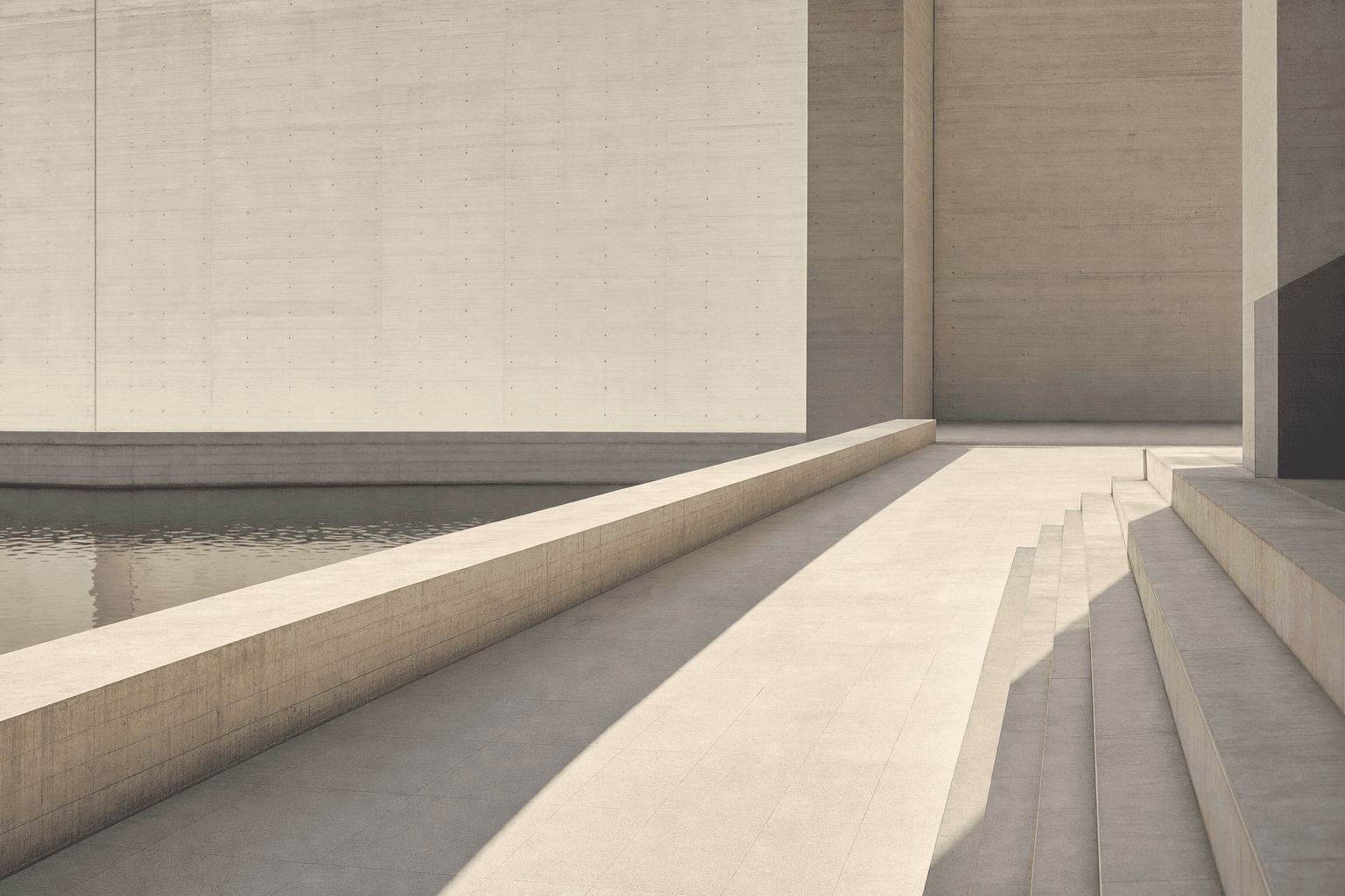Broad stone steps running down beside a still channel of water, against a tall board-marked concrete wall.